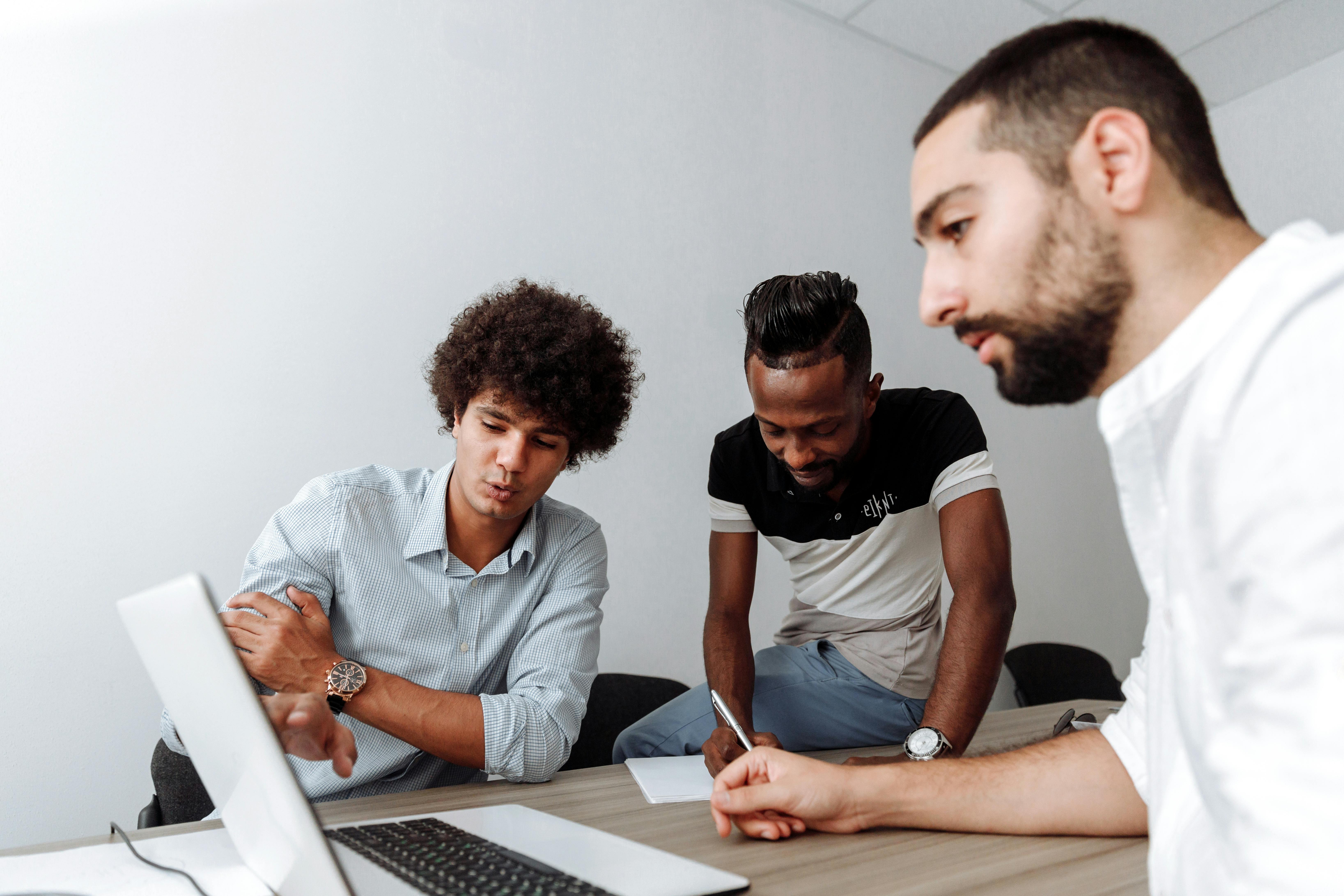 Men Brainstorming in a Conference Room